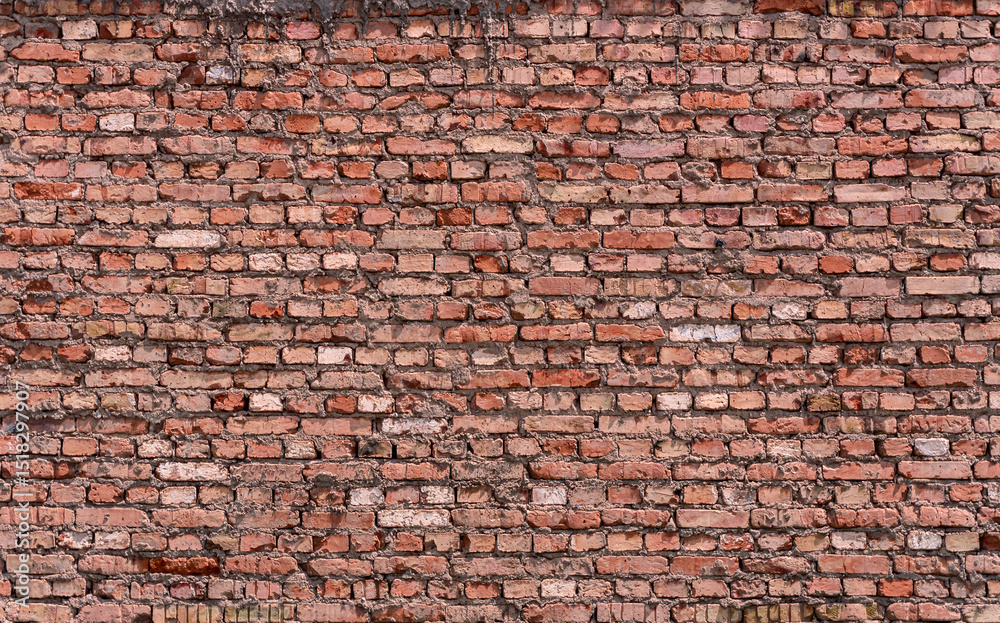 Naklejka premium Red brick wall texture background with cement joints. Mockup for architectural and urban design projects.