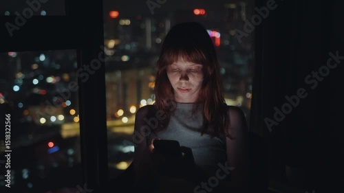 Wallpaper Mural Young woman using smartphone at night in front of city skyline Torontodigital.ca