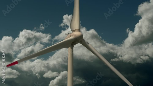 Wind Turbines Stands Tall against Beautiful Scenery of Clouds
