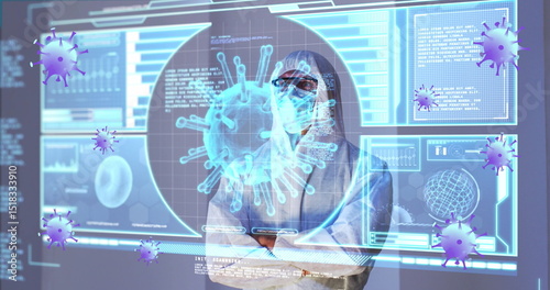 Image of purple virus cells over caucasian male lab worker in safety clothes with digital screen