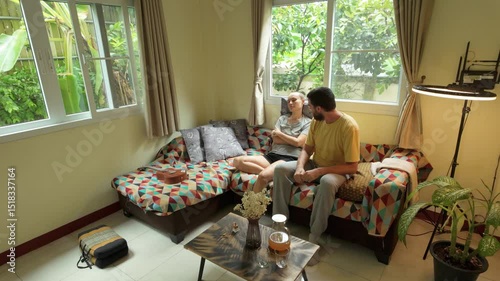 Couple having serious conversation in cozy living room