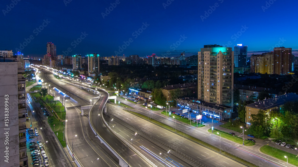 Fototapeta premium Traffic on avenue Marshal Zhukov timelapse in Moscow at night