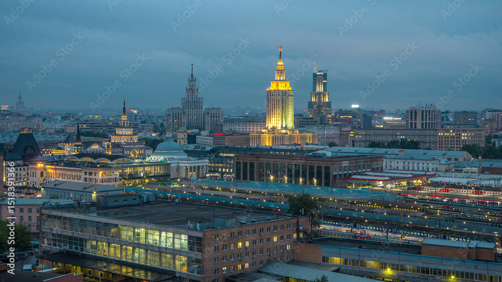 Fototapeta premium Evening top view of three railway stations day to night timelapse at the Komsomolskaya square in Moscow, Russia
