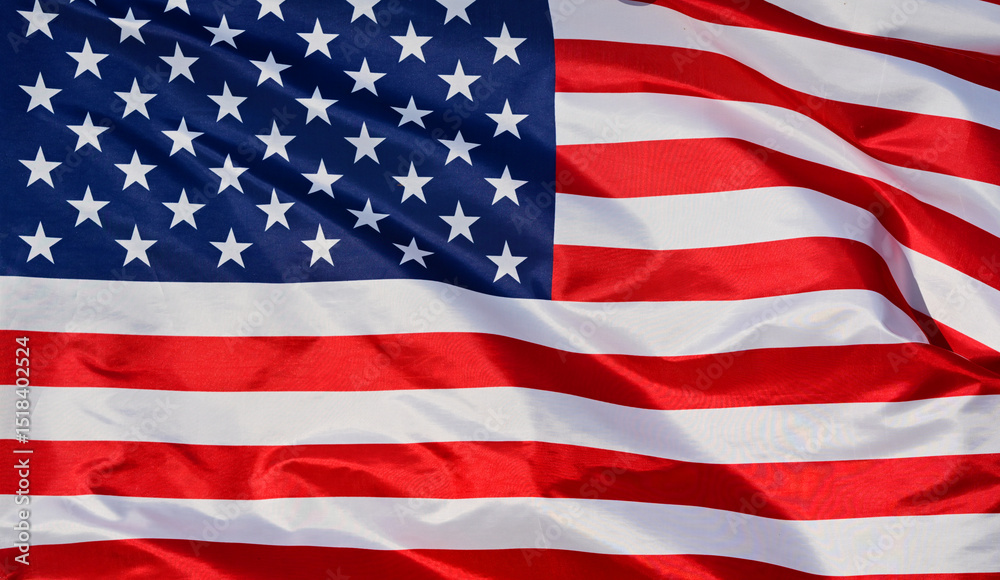 Obraz premium Close-up of the national flag of The United States, fluttering in the wind with folds, wave pattern
