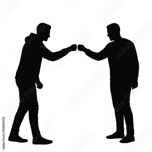 Two men silhouettes fist bumping greeting