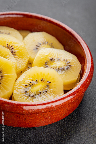 Kiwi yellow slices tasty fruit fresh delicious gourmet food background on table rustic food top view copy space keto and paleo diet vegan and vegetarian food