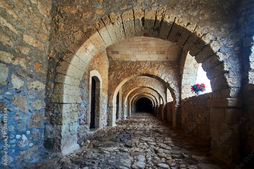 Naklejka premium a stone arcades of a historic monastery Orthodox Moni Arcadia on the island of Crete