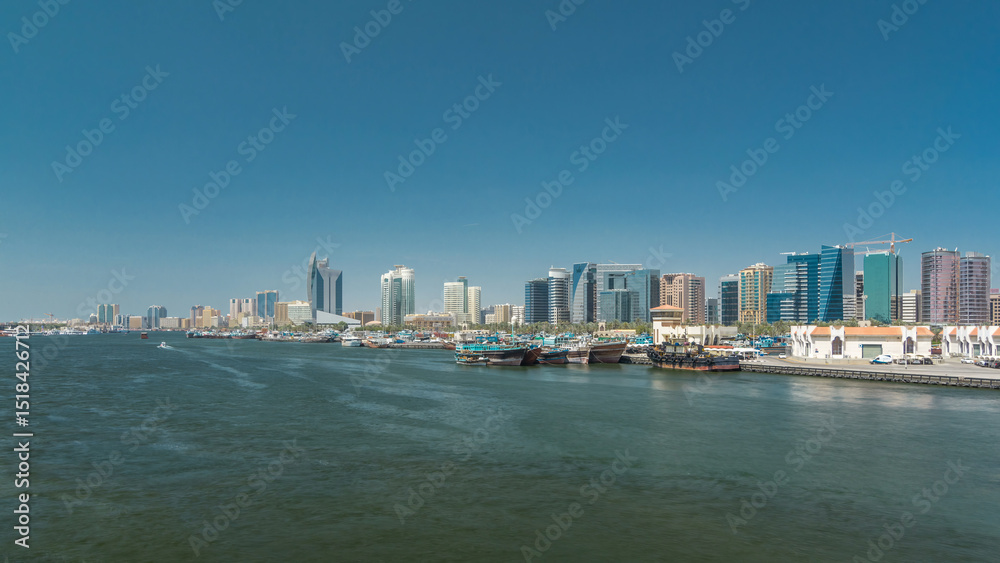 Fototapeta premium Trading wooden boats in the port timelapse hyperlapse. Merchant ships on the Creek Canal.