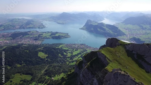 A stunningly breathtaking aerial view showcasing an expansive lake surrounded by majestic mountains
