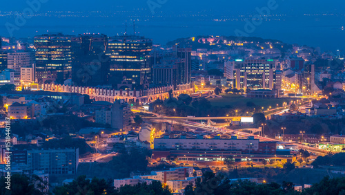 Panoramic view over Lisbon and Almada from a viewpoint in Monsanto night to day timelapse.
