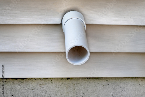 Close up PVC plastic tube pipe out from house or apartment