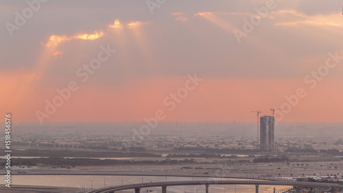 Construction and intersection near Dubai Creek Harbor aerial timelapse during sunrise. Dubai - UAE.