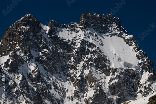 Glacier capped Mont Pelvoux in the Ecrins Mountains in the French Alps