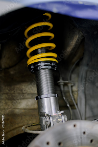 Yellow springs for cars.Upgrade your car's springs to be more efficient.Install new springs and shocks into the vehicle.Install springs and shocks on the front of the vehicle.
