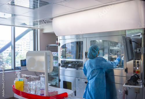 Robotic Chemotherapy Drug Compounding System in Hospital with an Operator back to the Camera.