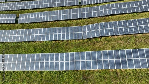 Rows of Photovoltaic Panels. Compose Renewable Energy. Drone Point of View. Solar Power Station Panels. Fields Green Energy at Sunset. Electrical Power Ecology environment. Electrical Innovation. 4k