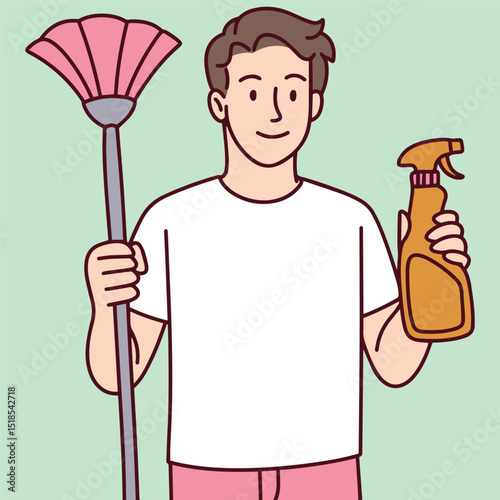 Young man holding a mop and cleaning spray, smiling, standing on a mint green background, representing cleanliness, sanitation work, or household chores