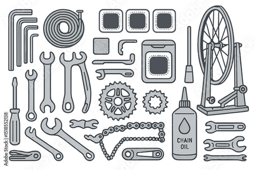 Bicycle repair tools and accessories arranged neatly on a flat surface in a workshop setting