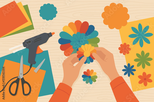 Crafting colorful paper flowers on a table with scissors, glue gun, and vibrant sheets of paper