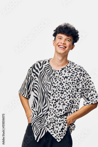 Smiling man in animal print t-shirt enjoying a carefree moment, casual style, youthful energy, fashion trend, isolated on white background, positive mood. photo