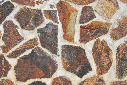 Natural rubble stone wall texture as background