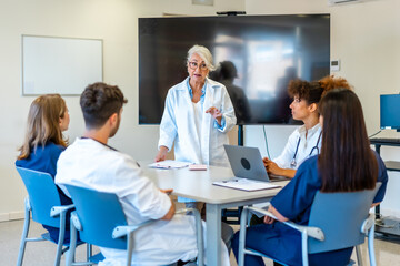 Senior doctor leading medical training for healthcare professionals