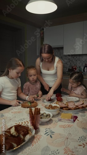 Happy family preparing a meal together in the kitchen.