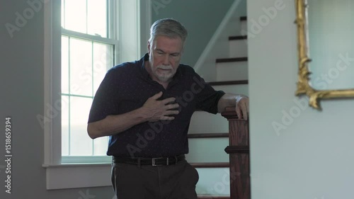 senior man walking downstairs fears a heart attack