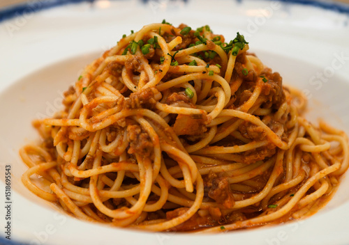 spaghetti bolognese with tomato sauce on a white plate