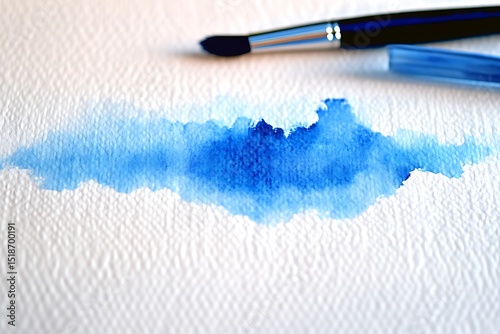 A delicate watercolor wash of sky blue tones blending softly on a textured paper background.