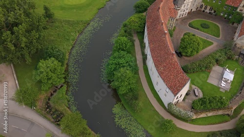 A panoramic drone view of the city and the castle, which sits on the water, in Steinfurt, Germany (Wasserschloss Burgsteinfurt)