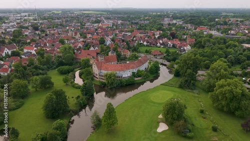 A panoramic drone view of the city and the castle, which sits on the water, in Steinfurt, Germany (Wasserschloss Burgsteinfurt)