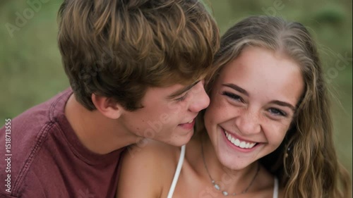 Young couple smiling and sharing affectionate moment outdoors