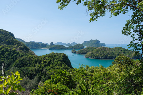 A wide-angle landscape photo of Mu Ko Ang Thong National Marine Park, located an hour's boat ride from Koh Samui. It features numerous small islands covered in lush tropical vegetation and a turquoise