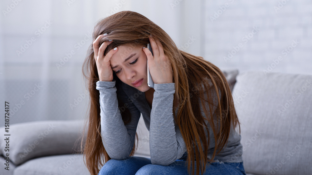 Upset young woman talking to her psychologist on cellphone, receiving help in depression treatment at home. Millennial lady having relationship problems, consulting her therapist on phone Upset young woman talking to her psychologist on cellphone, receiving help in depression treatment at home. Millennial lady having relationship problems, consulting her therapist on phone