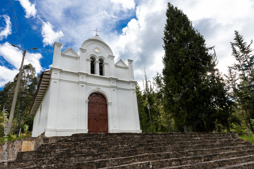 Fototapeta premium Tibasosa, Boyaca - Colombia. May 8, 2025. Chapel of the Immaculate Conception, located at the top of a hill, accessed by a stone staircase.