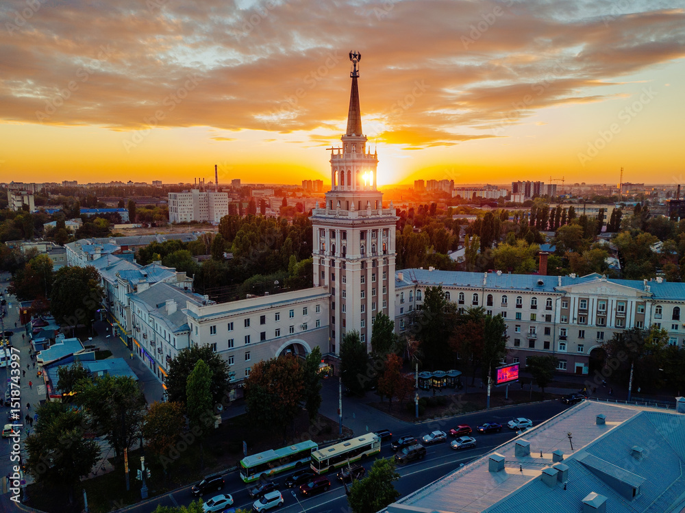 Naklejka premium Evening summer Voronezh cityscape. Tower in architecture Stalinist empire at crimson sunset