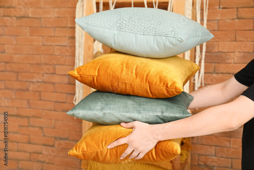 Woman holding stack of soft...