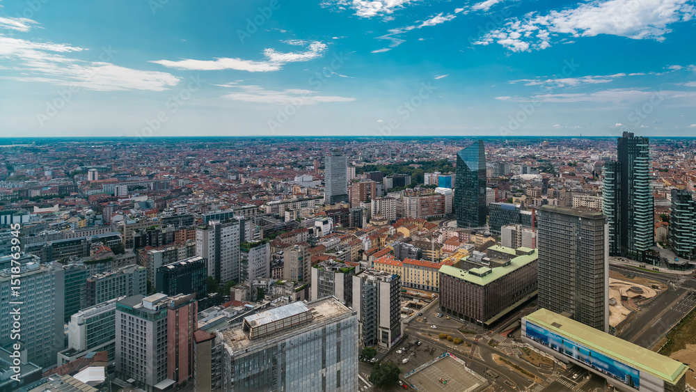 Fototapeta premium Milan aerial view of modern towers and skyscrapers and the Garibaldi railway station in the business district timelapse
