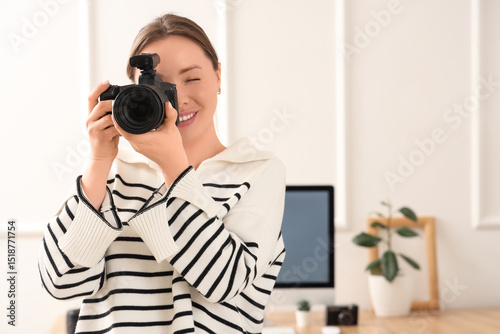 Female photographer with ca...