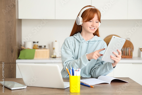 Little redhead girl studyin...