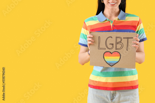 Young woman holding placard...