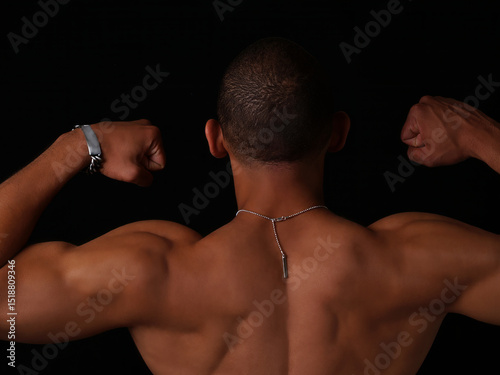 Topless African American Man From Back Showing Muscles