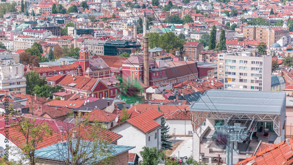Naklejka premium City panorama with cable car moving up and down from Sarajevo station to mountains, Bosnia And Herzegovina