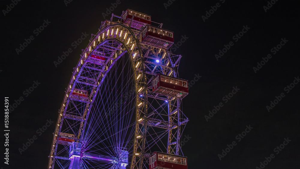 Fototapeta premium Wiener Riesenrad in Prater night timelapse - oldest and biggest ferris wheel in Austria.