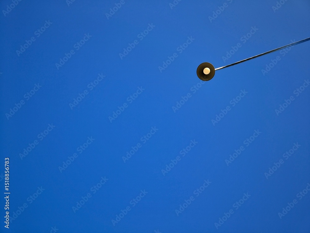 Fototapeta premium Street Lights with Bright Blue Sky Background, this photo is suitable for background, decoration, wallpaper