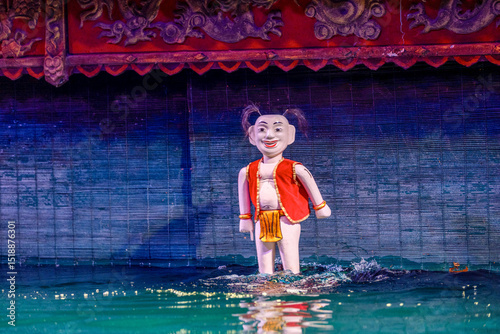 Traditional Vietnamese water puppet dolls theatre show in Hanoi, Vietnam, water puppetry doll show, in Thang Long theatre , one of the most traditional water puppet show in Hanoi, Vietnam.