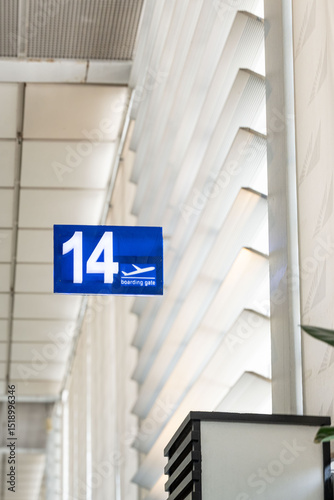 Blue information board showing travelers the way to the boarding gates at daytime inside the airport for domestic flights of Ninoy Aquino International Airport in Manila.