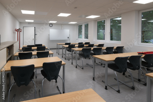 a classroom full of tables and chairs
