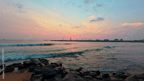 Landscape twilight golden dusk sunset over tranquil gentle wave at Galle Face beach, Colombo, Sri lanka. 4K video.